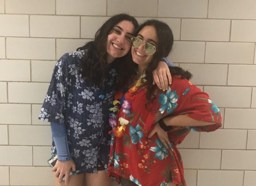 Juniors Lexie Finkelstein and Kaela Bernard sport Hawaiian-print shirts for a tropical theme.