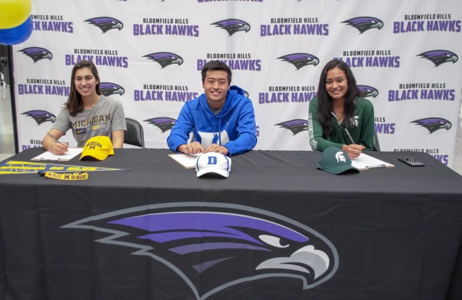 Mikaela, Andrew, and Tia signing their letters of intent
