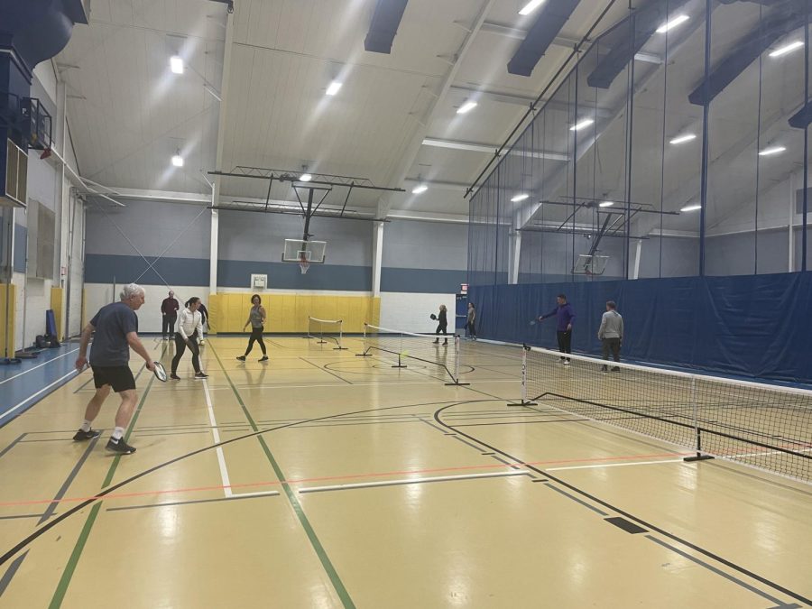 Community+members+play+pickleball+with+Superintendent+Watson+at+West+Hills+Middle+School